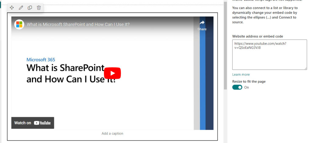 Screenshot of a web page embedding a YouTube video titled “What is Microsoft SharePoint and How Can I Use It?”; video is paused on a white slide with the same title in blue and black text. A sidebar shows an embed code and video URL.