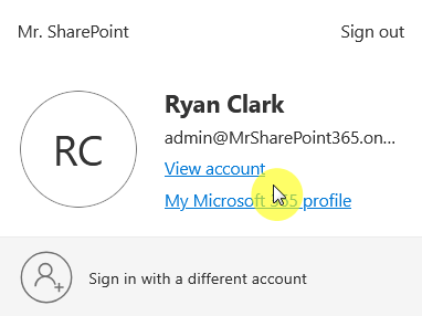 Screenshot of a Microsoft account profile dropdown showing Ryan Clark’s account email with options to view account, access Microsoft 365 profile, or sign in with a different account.