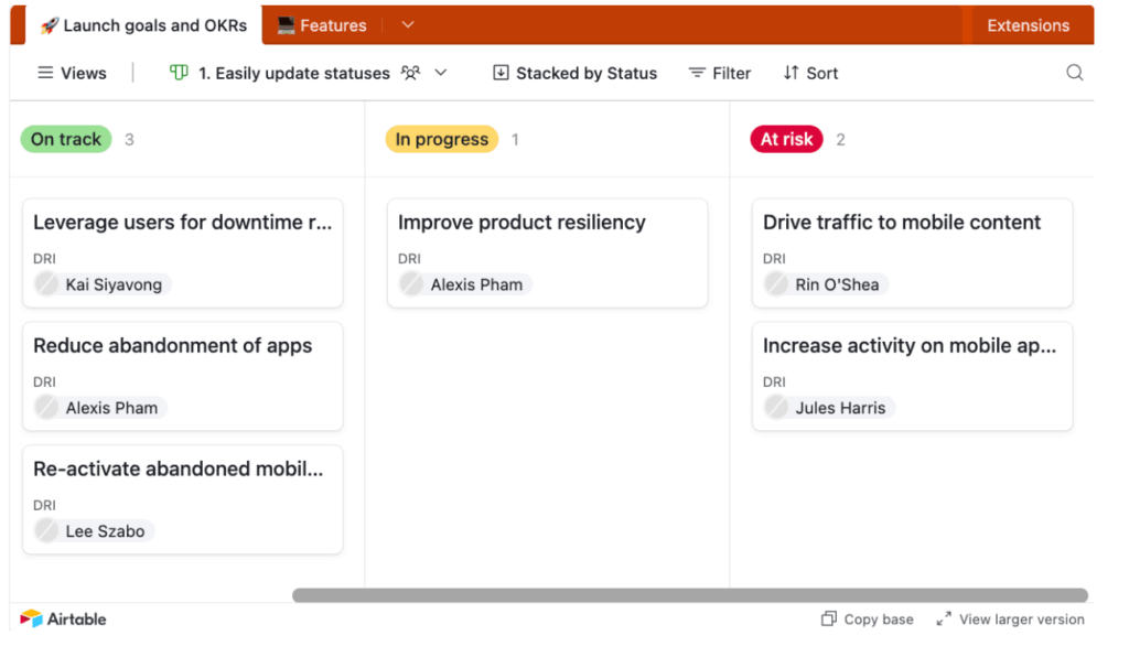 A project management board in Airtable shows goals and OKRs divided into columns: On track, In progress, and At risk. Each column lists tasks with assignees names on labeled cards.