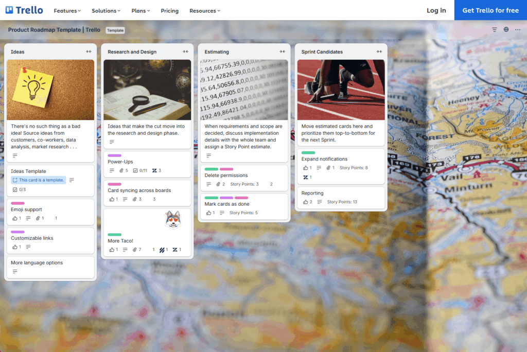 A Trello board titled Product Roadmap Template with five columns: Ideas, Research and Design, Estimating, Sprint Candidates, and Next Up, each containing multiple task cards. The background shows a close-up map.